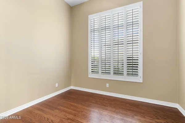 a view of a patio with table and chairs with wooden fence and plants