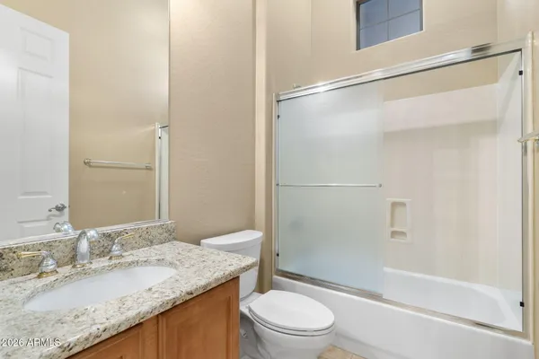 an aerial view of a house with outdoor space