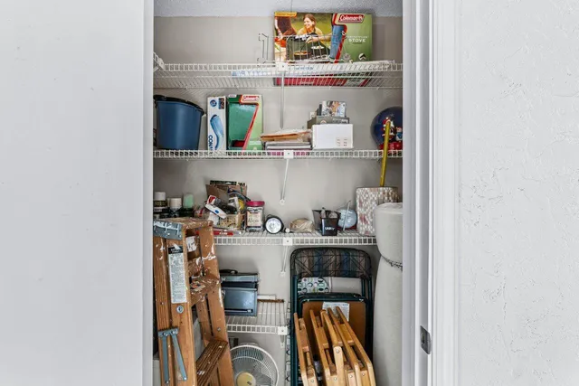 a utility room with cabinets washer and dryer