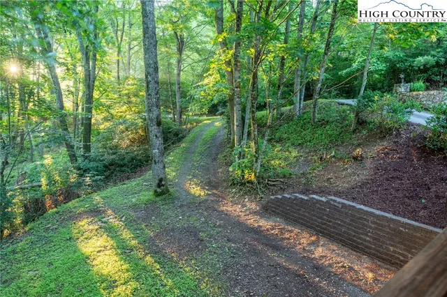 a view of a backyard with sitting area