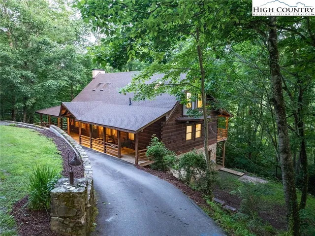 a view of a room with wooden floor and furniture