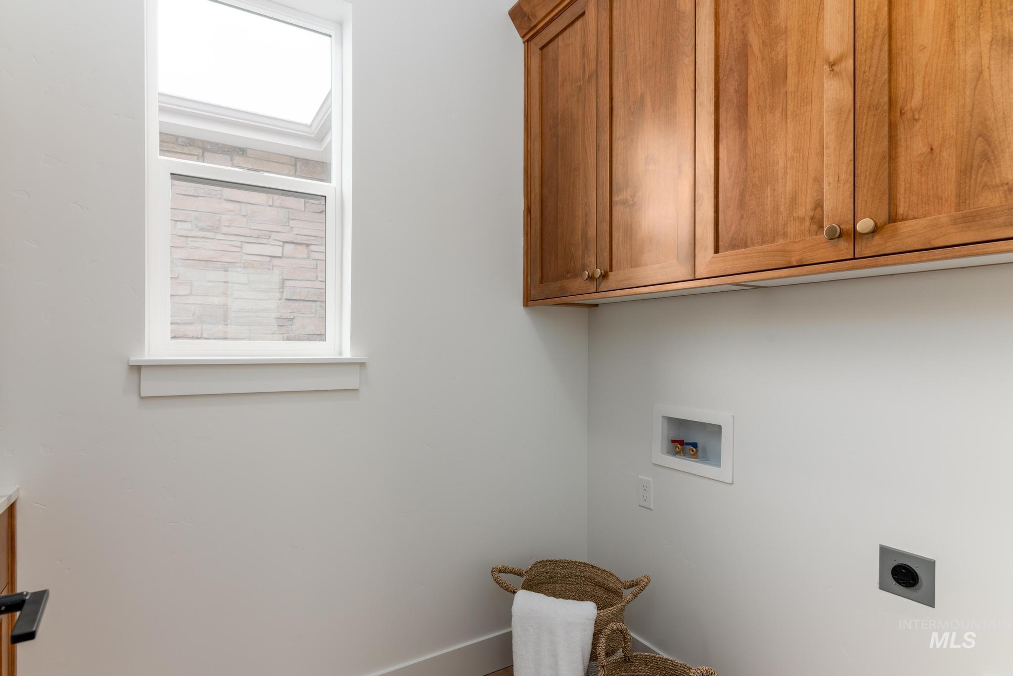 9044 West Purple Martin Street Star, ID 83669 - Photo 12 of 14 Laundry area featuring cabinet space, hookup for a washing machine, and electric dryer hookup