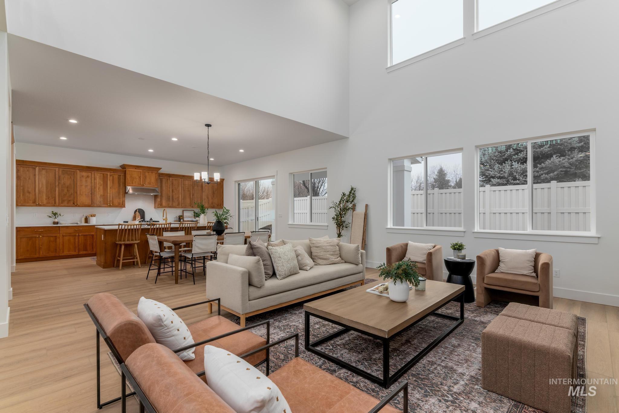 9044 West Purple Martin Street Star, ID 83669 - Photo 4 of 14 Living area featuring light wood-style floors and a chandelier