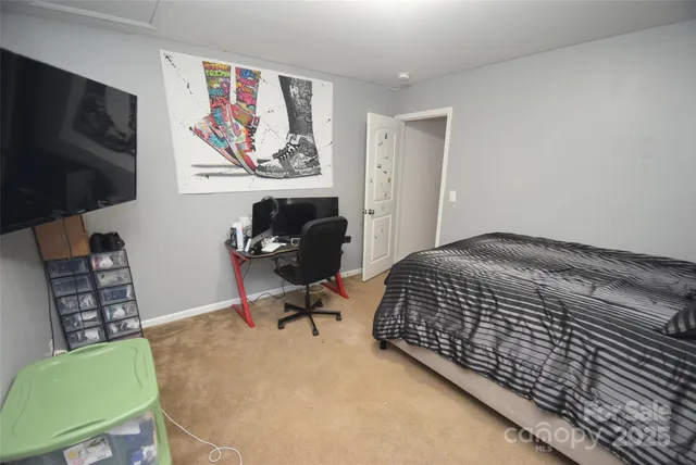 a bedroom with a bed and a chair