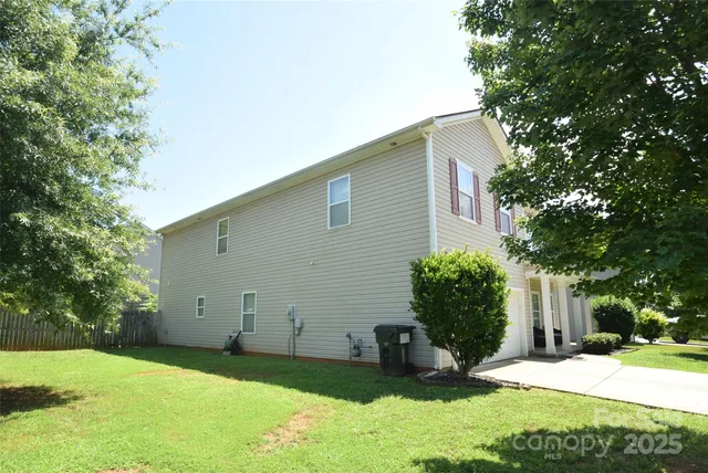 a backyard of a house with yard and garage