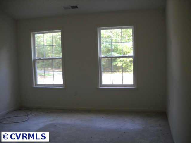 278 Cedar Ridge Drive Ruther Glen, VA 22546 - Photo 6 of 7 a view of an empty room with a window