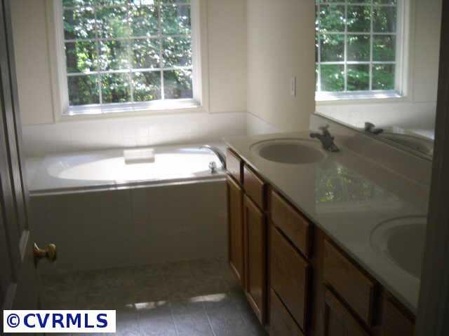 278 Cedar Ridge Drive Ruther Glen, VA 22546 - Photo 7 of 7 a bathroom with a sink window and shower