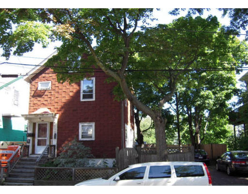 27 Decatur Street Cambridge, MA 02139 - Photo 2 of 4 a front view of a house with a yard