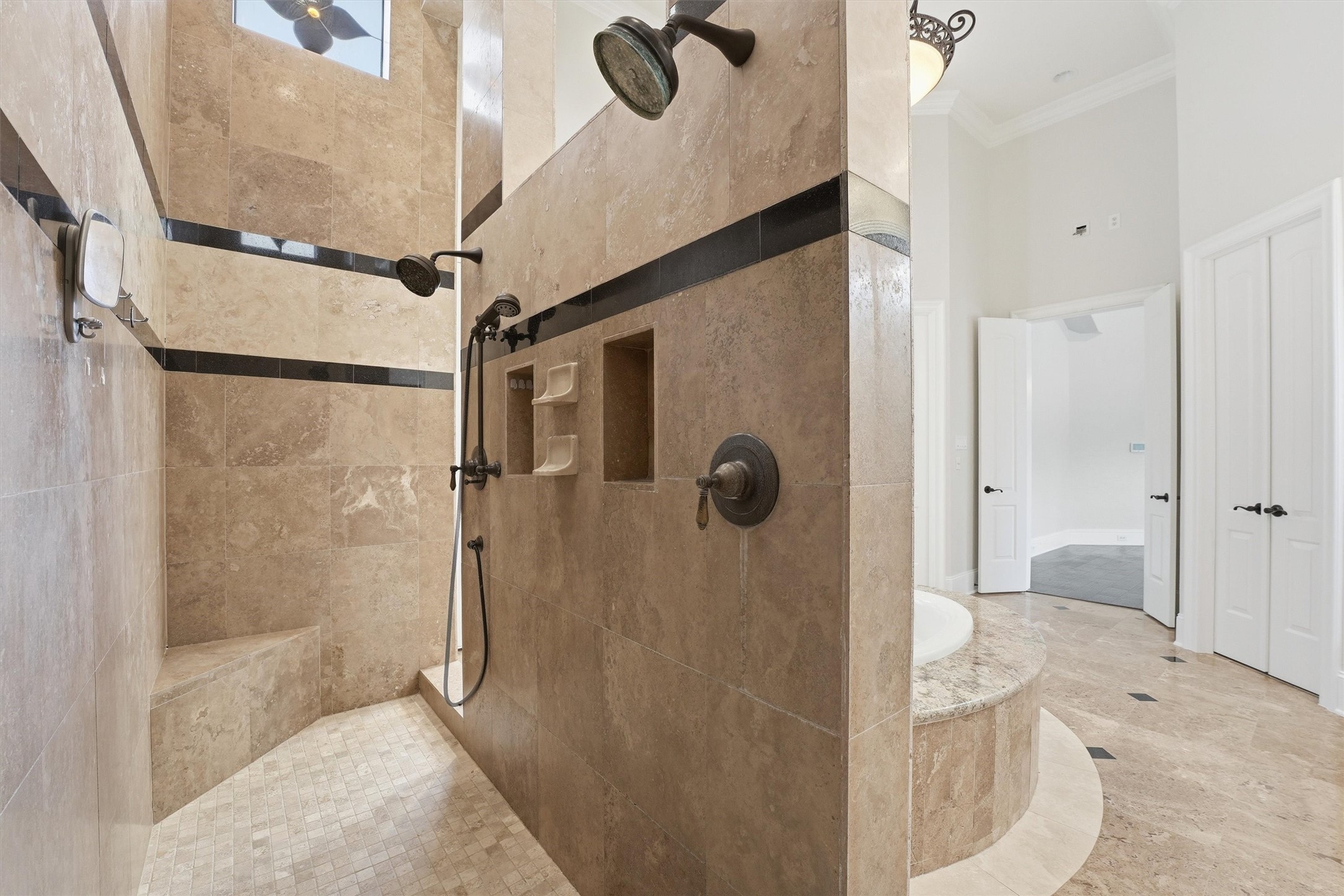 70 Quail Rock Place The Woodlands, TX 77381 - Photo 21 of 46 a bathroom with a shower and mirror