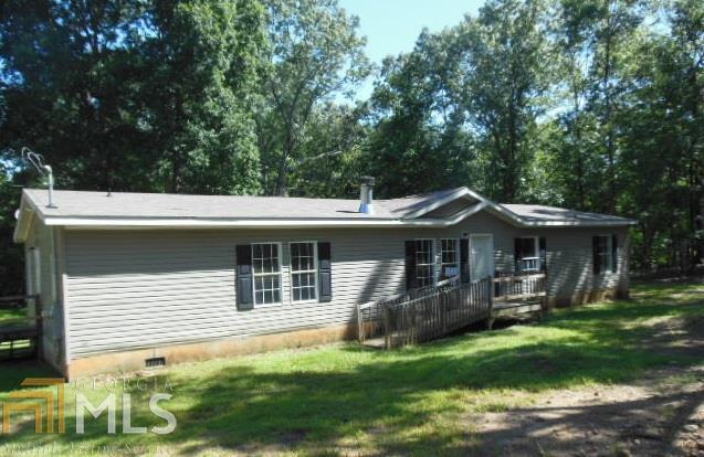 1033 Rainey Road Temple, GA 30179 - Photo 1 of 1 a front view of a house with a yard