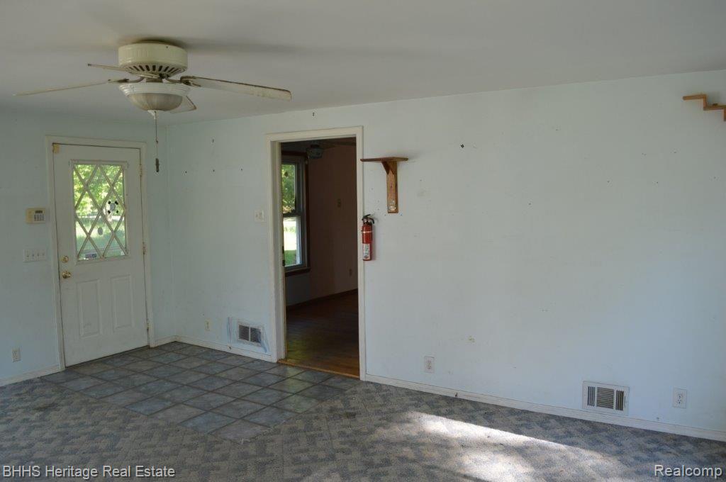 2450 East Coon Lake Road Howell, MI 48843 - Photo 21 of 49 Florida Room with side door to outside