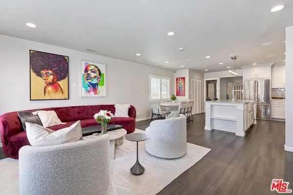 a living room with furniture kitchen and a kitchen view