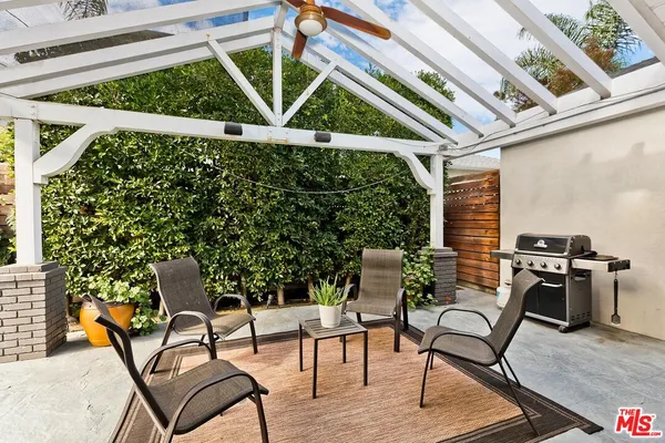 a patio with table and chairs