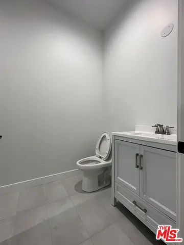 a bathroom with a toilet and a sink