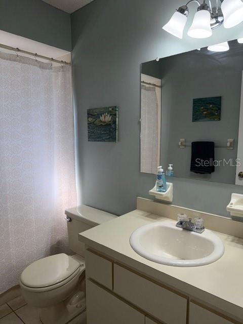 10740 Southwest 62nd Avenue Road Ocala, FL 34476 - Photo 11 of 19 a bathroom with a toilet sink and mirror