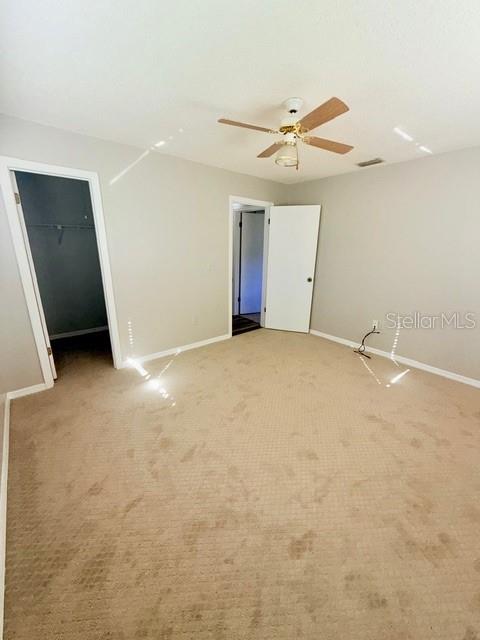 10740 Southwest 62nd Avenue Road Ocala, FL 34476 - Photo 16 of 19 an empty room with closet and a ceiling fan