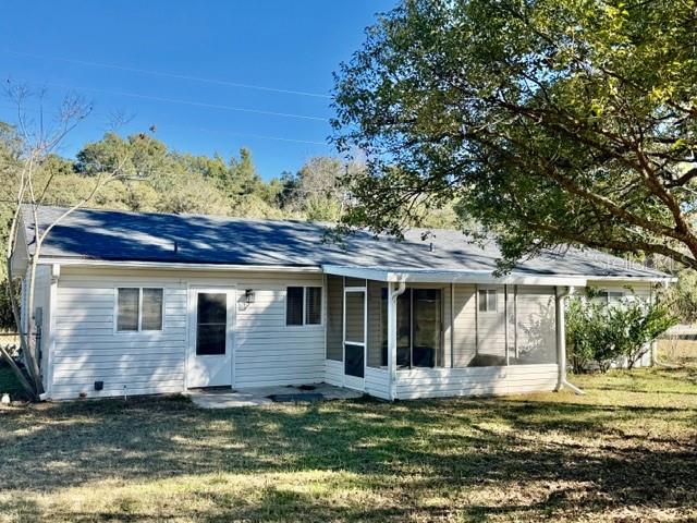10740 Southwest 62nd Avenue Road Ocala, FL 34476 - Photo 2 of 19 a view of a house with a big yard potted plants and large tree
