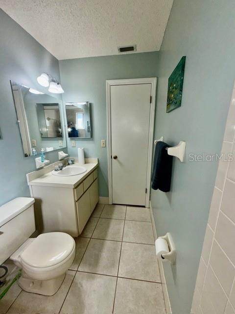 10740 Southwest 62nd Avenue Road Ocala, FL 34476 - Photo 10 of 19 a bathroom with a sink toilet and mirror