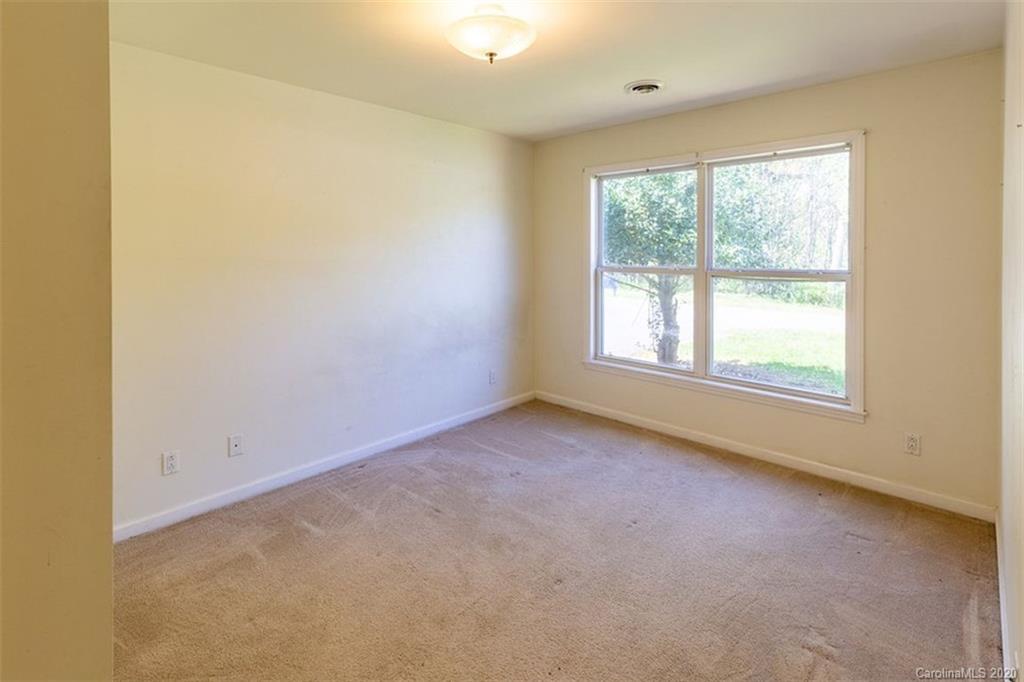 171 North Ridge Point, Unit V2 Sylva, NC 28779 - Photo 17 of 34 an empty room with a window