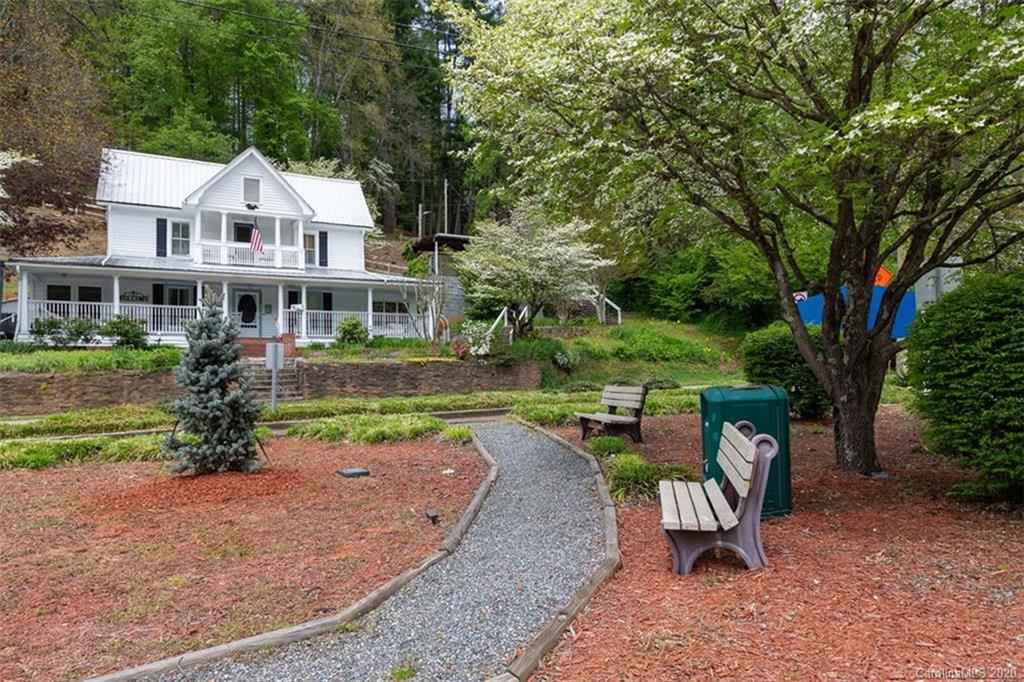 171 North Ridge Point, Unit V2 Sylva, NC 28779 - Photo 22 of 34 a view of a house with backyard porch and sitting area