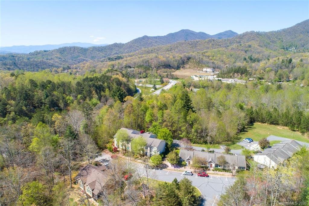 171 North Ridge Point, Unit V2 Sylva, NC 28779 - Photo 5 of 34 a view of a lush green hillside and houses