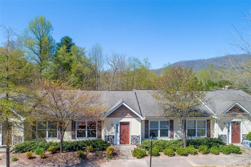 171 North Ridge Point, Unit V2 Sylva, NC 28779 - Photo 7 of 34 a front view of a house with a yard