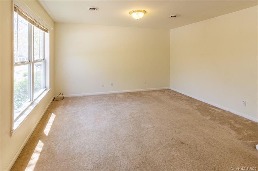 171 North Ridge Point, Unit V2 Sylva, NC 28779 - Photo 10 of 34 a view of an empty room with a window