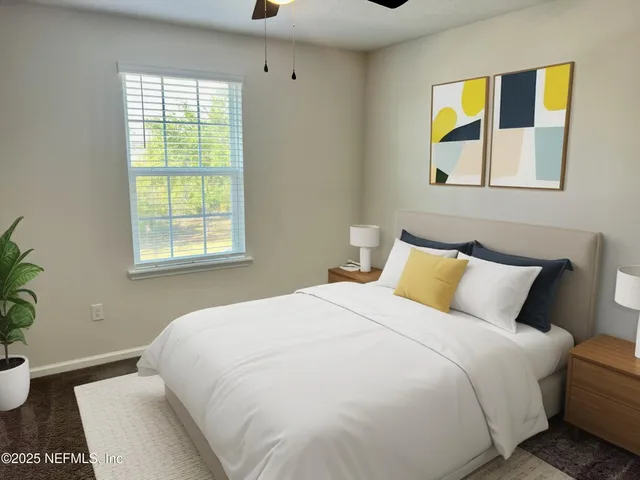 a bedroom with a bed and a window