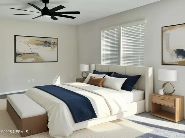 a bedroom with bed and ceiling fan