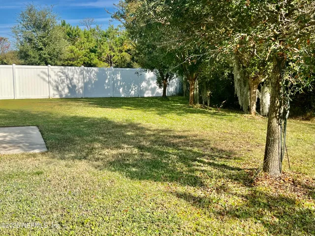 a view of a yard with an outdoor space