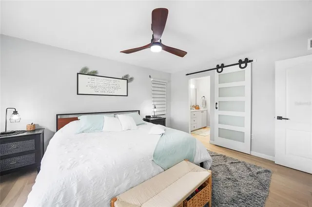 a bedroom with a bed and a dresser