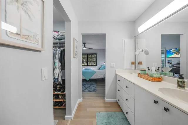 a spacious bathroom with a double vanity sink and a mirror