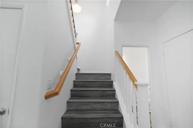 a view of a hallway with staircase