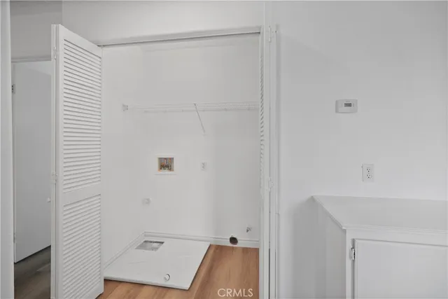 a bathroom with a shower and a sink