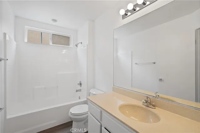 an aerial view of a house with a yard basket ball court and outdoor seating