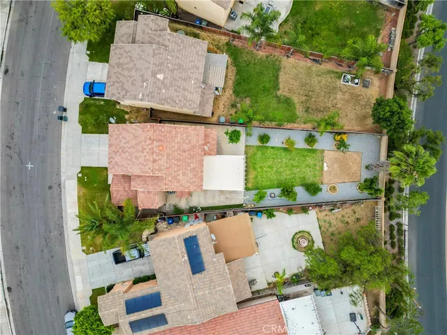 an aerial view of multiple houses with yard