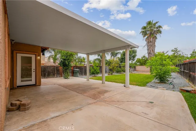 a view of a house with a yard and plants