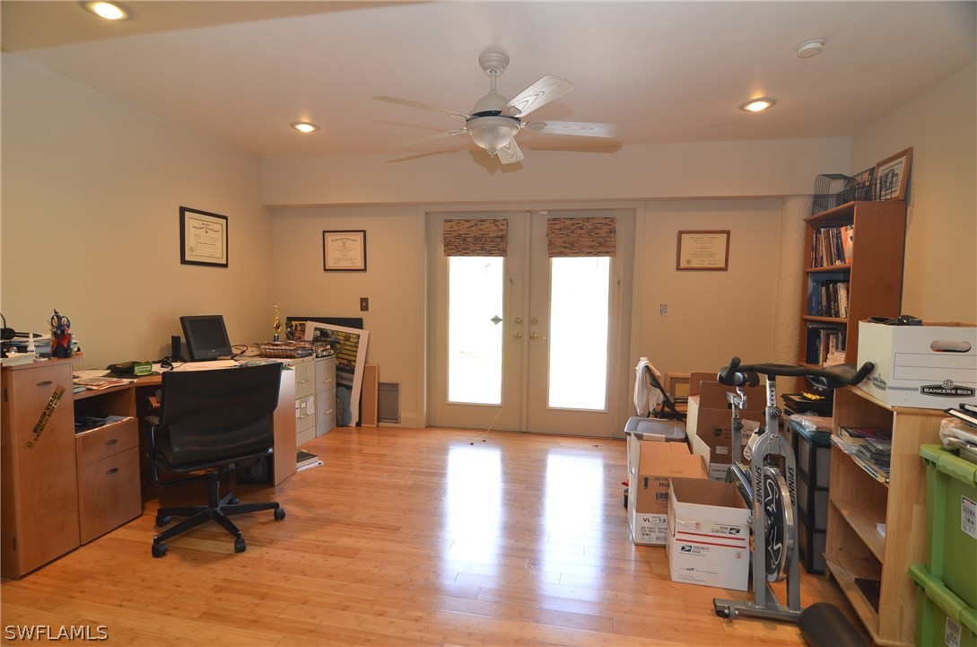 8312 Riviera Avenue Fort Myers, FL 33919 - Photo 18 of 24 a workspace with furniture window and wooden floor