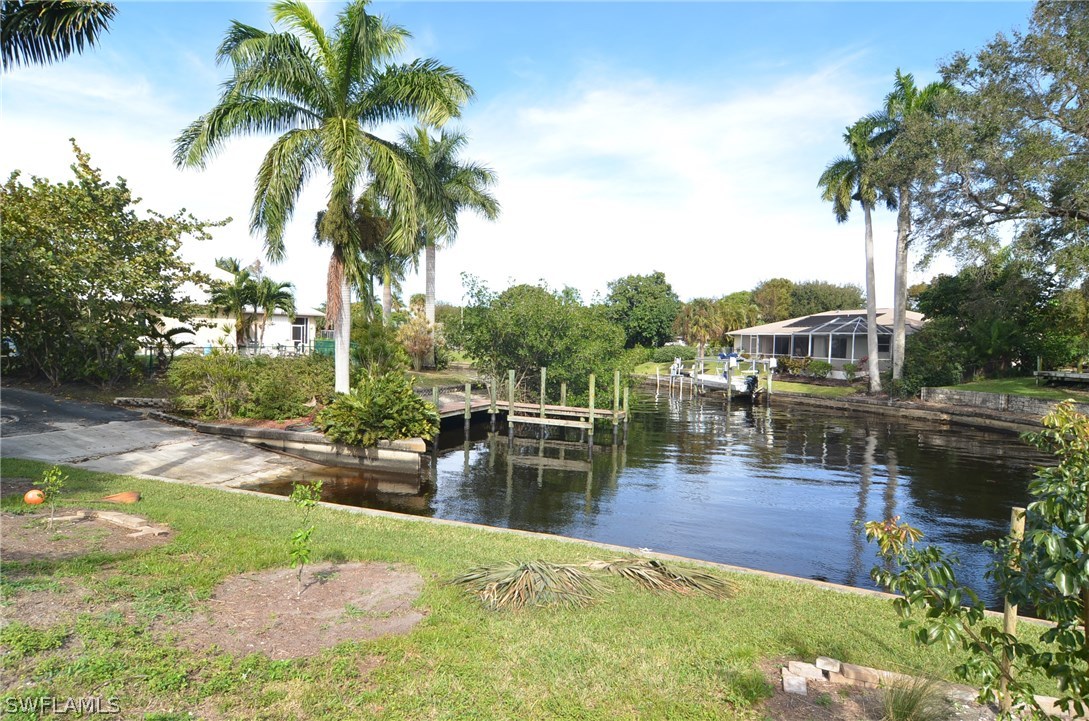 8312 Riviera Avenue Fort Myers, FL 33919 - Photo 22 of 24 a swimming pool with outdoor seating and yard