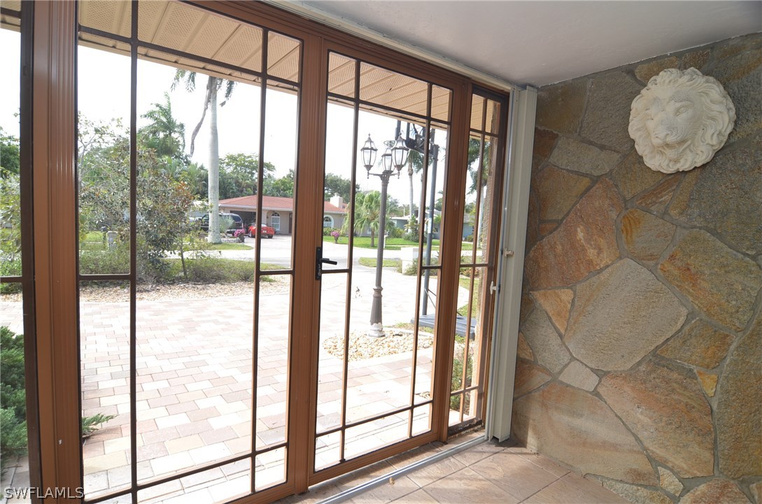 8312 Riviera Avenue Fort Myers, FL 33919 - Photo 4 of 24 a view of entryway with wooden floor