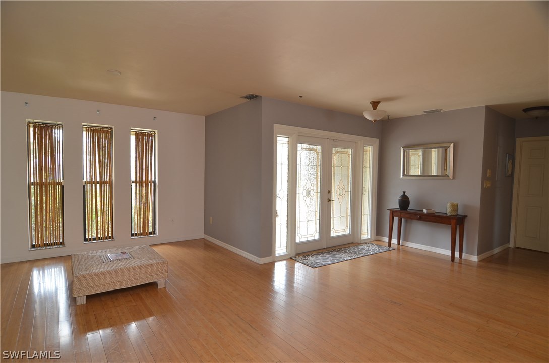 8312 Riviera Avenue Fort Myers, FL 33919 - Photo 6 of 24 a view of livingroom with furniture wooden floor and windows