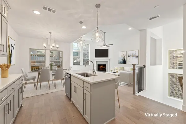 a open kitchen with stainless steel appliances granite countertop a stove oven and a refrigerator with the cabinets