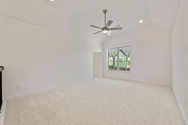 a kitchen with stainless steel appliances granite countertop a stove top oven a sink dishwasher a refrigerator and a dining table with wooden floor