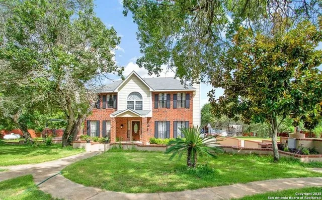 a view of a house with a yard porch and sitting area
