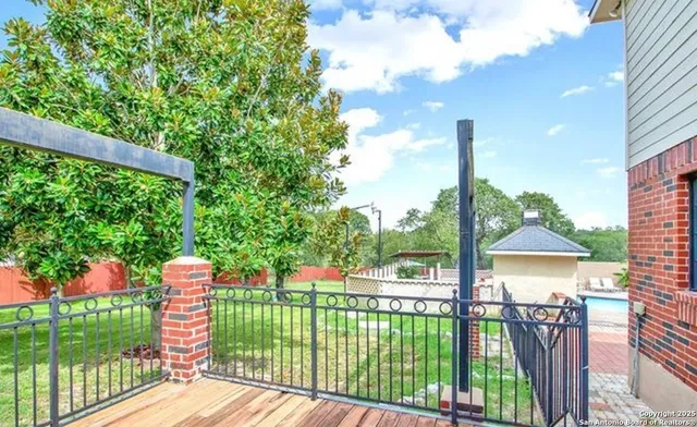 a view of a garden and trees