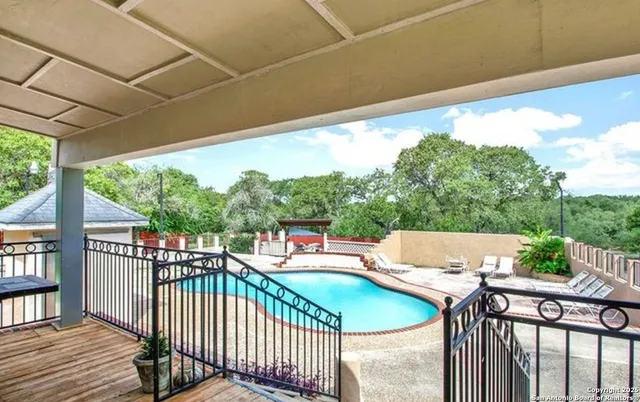 a view of a patio with wooden floor