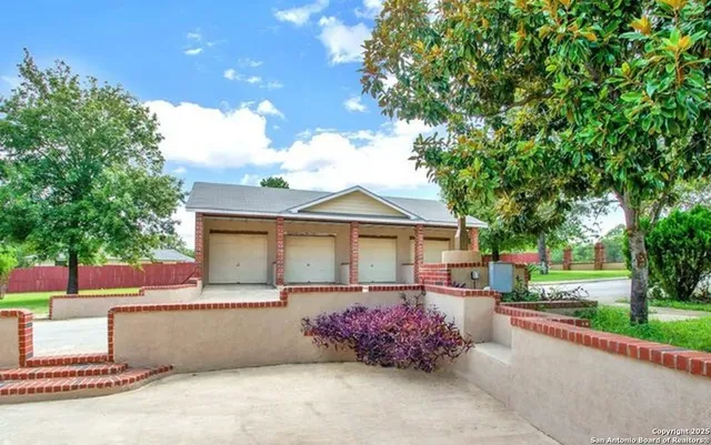 a front view of a house with a yard and a garage