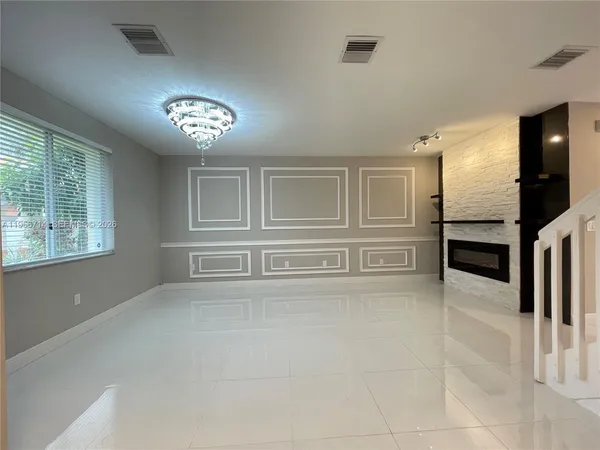 a view of a refrigerator in a room