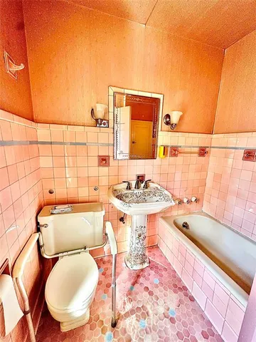 a bathroom with a sink and mirror