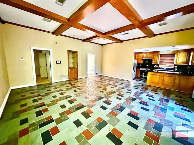 a bathroom with a sink a toilet a mirror and shower